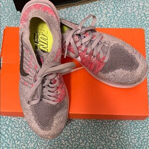 Nike Gray and Pink Sneakers with Breathable Knit Design
